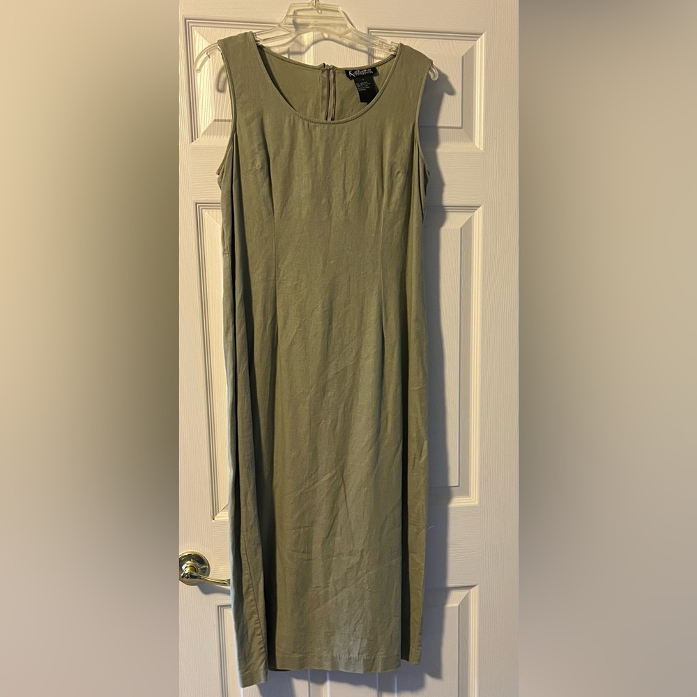 Long light green sleeveless linen dress.